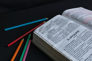 study bible and colored pencils