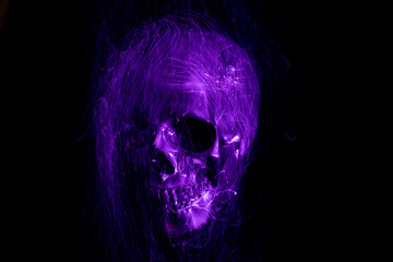 Photo in the style of light painting, abstract, skull on a black background