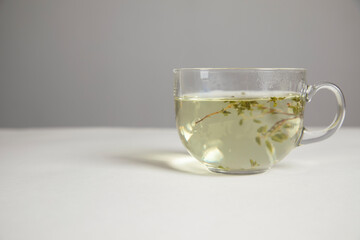 Glass cup of hot aromatic tea
