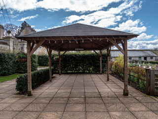 Fototapeta premium View of the wooden terrace on decorative concrete slabs