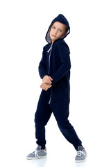 Portrait of boy in blue hoodie with serious face