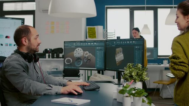 Diverse team of engineer architects working on modern cad program developing construction metalic components. Industrial designer studying prototype idea on pc showing digital software with gears