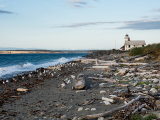 Scenic view of historic Point Wilson Lighthouse in Fort Worden in the evening - Port Townsend, WA,...