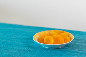 delicious apricots on the table with blue towel
