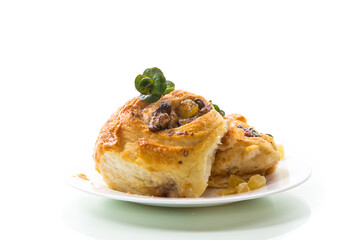 Sweet curled bun with jam, raisins in powdered sugar