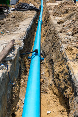 Construction site with new Water Pipes in the ground. sewer pipes to repair or restore in street...