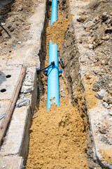 Construction site with new Water Pipes in the ground. sewer pipes to repair or restore in street...