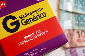 Brazilian Generic Medicine (Medicamento Genérico) with Brazilian money in the background. Concept of the cost of Generic Medicines in Brazil. 
