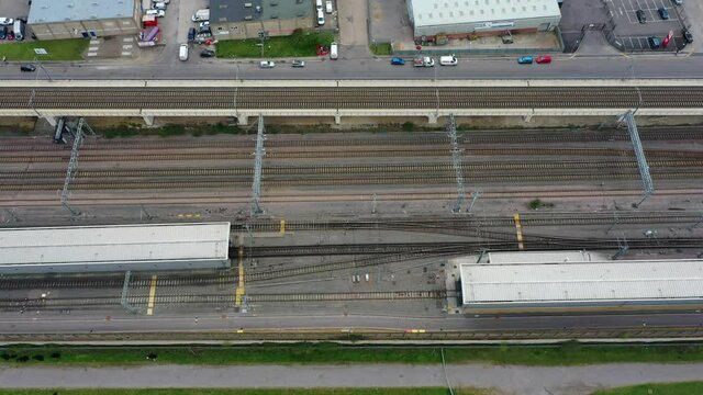 4K aerial footage electrified train lines in an industrial urban area, UK