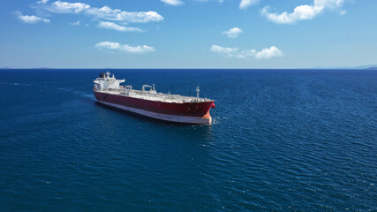 Aerial drone photo of crude oil super tanker cruising in low speed in deep blue sea of Saronic gulf near port of Piraeus, Attica, Greece
