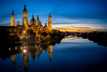 Cathedral-Basilica of Our Lady of the Pillar with evening lights in the city of Zaragoza, Aragon