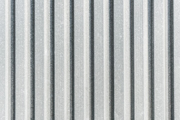Corrugated metal sheet background. Grunge old grainy metal texture. Silver color industrial...