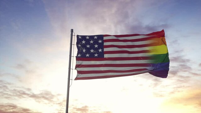 Waving national flag of USA and LGBT rainbow flag background