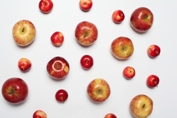 Many different scattered apples isolated on a white background