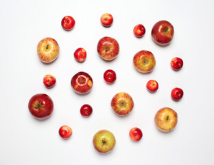 Many different scattered apples isolated on a white background