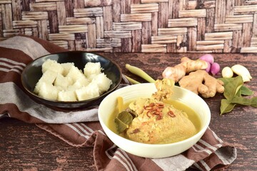 Opor ayam, chicken cooked in coconut milk from Indonesia, from Central Java, served with lontong....