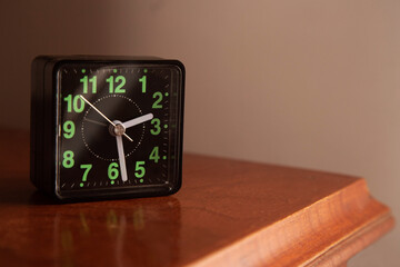 Alarm clock on a bedside table 