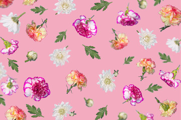 Spring or summer pattern made with different flying flowers and leaves on a pastel pink background, trendy floral layout.