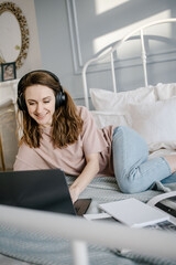 woman working on laptop remotely from home