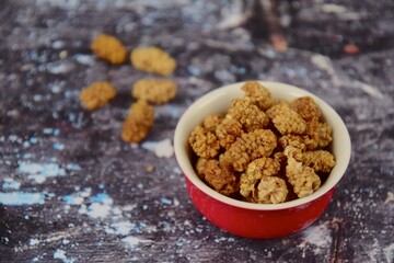 Dried mulberry on grey background