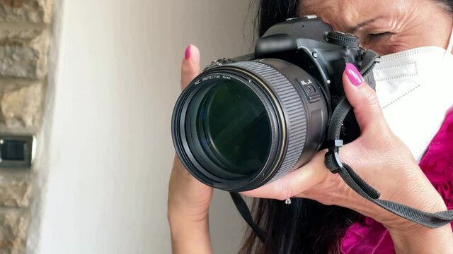 Female photographer taking pictures of home interior