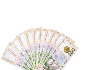 fans of 500 hryvnia bills (ukrainian money) and one coin  isolated on white background with free space for your text. Money and financial concept