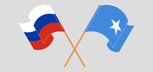 Crossed and waving flags of Russia and Somalia