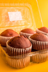 various muffins with yellow background