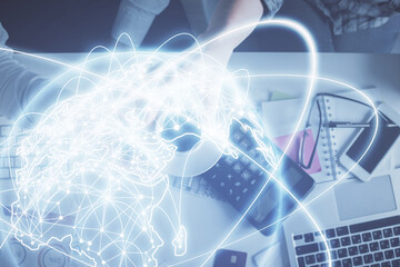 Double exposure of man and woman working together and business theme hologram drawing. Computer background. Top View.