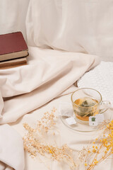 photo for social networks of cup of tea in the morning with book