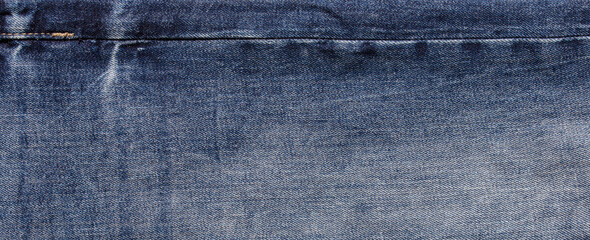 texture of dark blue jeans denim fabric background	
