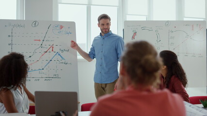 Business man pointing hand white board office. Team leader presenting strategy