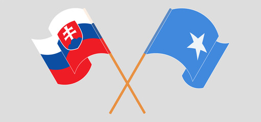 Crossed and waving flags of Slovakia and Somalia