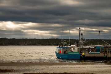 Sun shined through clouds in the evening at the harbour
