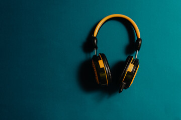 yellow audio headphones  concept, podcast, music