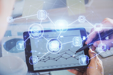 Double exposure of man's hands holding and using a phone and social network theme drawing.