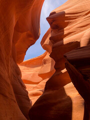 Narrow Sandstone Passage with Sky View