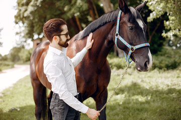 Obraz premium Handsme man standing in a ranch