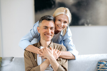 Family tenderness relations. Portrait of senior handsome Caucasian married couple in casual stylish...