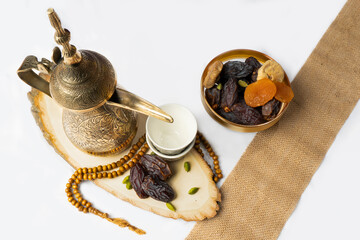 Eid and Ramadan set with Arabian coffee and dates set in a light background. Festive greeting card, an invitation for Muslim holy month Ramadan Kareem or Eid al Adha and Eid al fiter