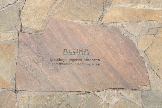 Hawaiian tiles embedded in the sidewalk of Kalakaua Avenue in Waikiki 
