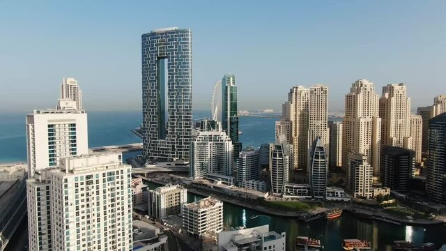Aerial footage of an amazing skyscrapers in the shape of letter O, Dubai, 4k