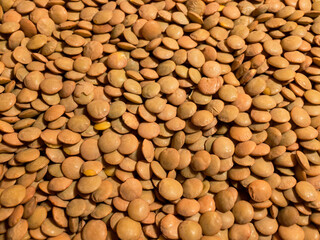 Raw lentils. Background. Close up.