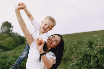 Cute and stylish family in a summer park