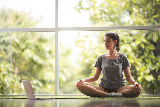 online learning yoga on internet, person lifestyle indoor exercise at home, fitness sport training for healthy woman, female happy workout in living room at home, yoga self-learning relaxation