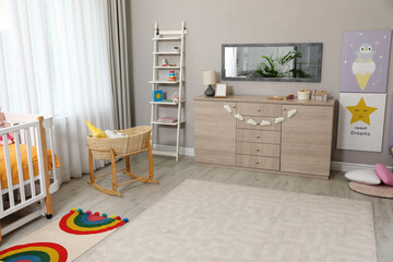 Beautiful baby room interior with stylish furniture