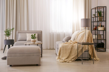 Stylish living room interior with comfortable sofa