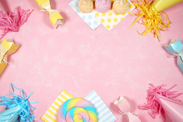 Birthday and party theme flatlay styled with party hats and bon bons. Blog hero header creative composition layout. Negative copy space.