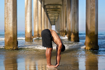 Yoga Male Afro-American Instructor in Gorilla Pose