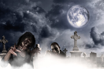 Scary zombies at misty cemetery under full moon. Halloween monster